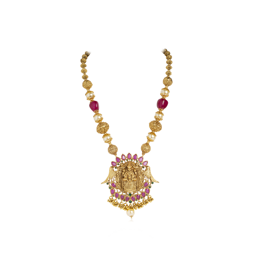 Gold plated temple necklace featuring goddess with emerald and red beads along with white pearls