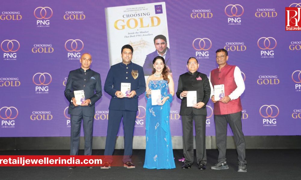 PNG Jewellers CMD Saurabh Gadgil launches his memoir Choosing Gold at a Mumbai event with Madhuri Dixit.
