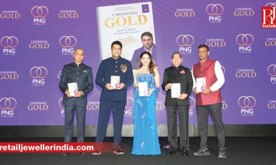 PNG Jewellers CMD Saurabh Gadgil launches his memoir Choosing Gold at a Mumbai event with Madhuri Dixit.